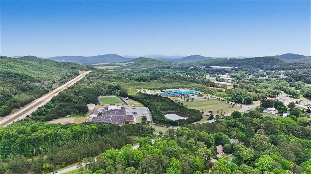 233 Old Old Alabama Road Southeast Emerson, GA 30137 - Photo 48 of 49 an aerial view of a city with lots of residential buildings and mountain view in back
