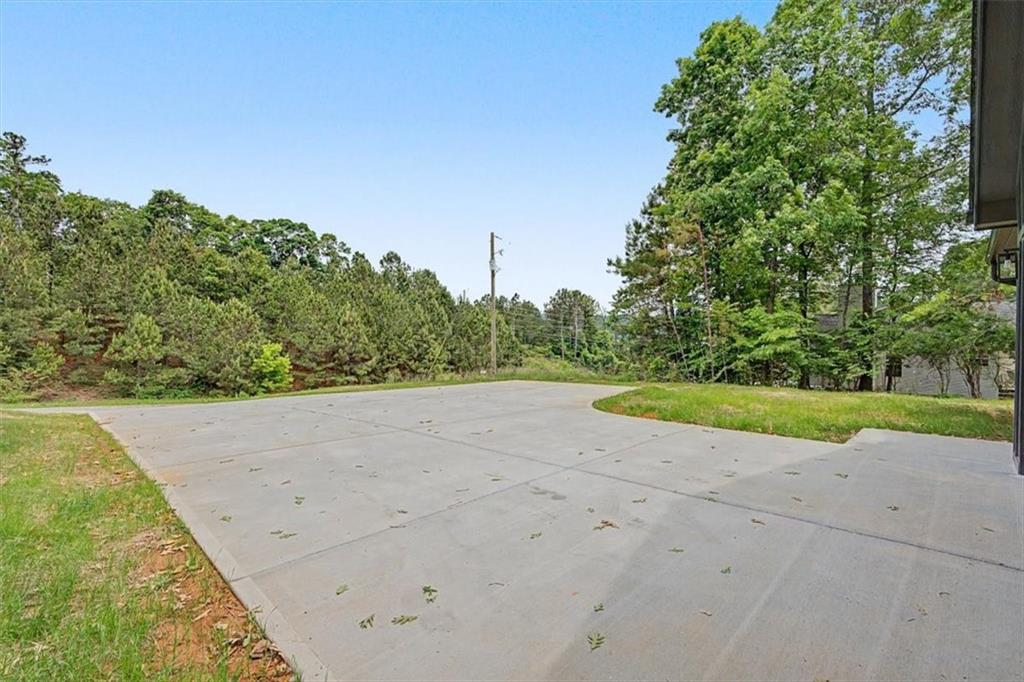 233 Old Old Alabama Road Southeast Emerson, GA 30137 - Photo 5 of 49 a view of a road with a yard