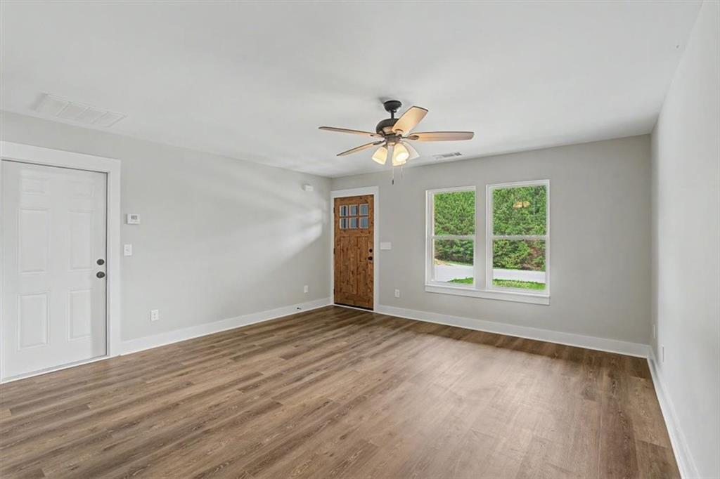 233 Old Old Alabama Road Southeast Emerson, GA 30137 - Photo 10 of 49 a view of an empty room with a window and wooden floor
