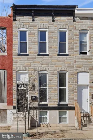 a brick building with four windows
