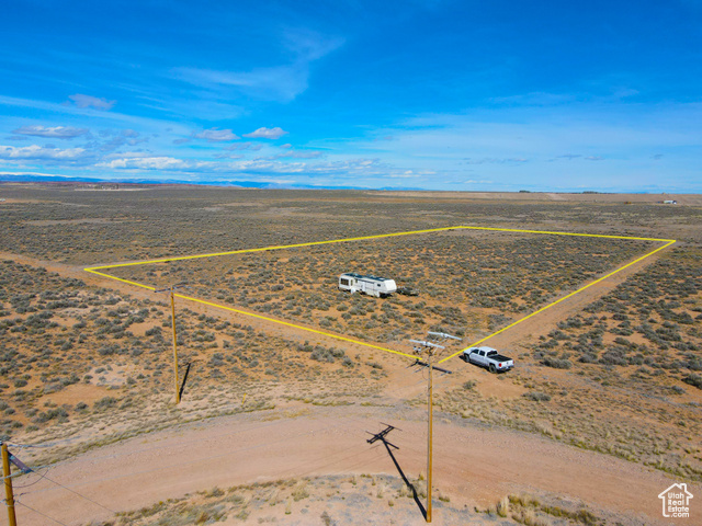 6000 South Well Road East, Unit 6 Duchesne, UT 84021 - Photo 1 of 12 Overview of rural landscape with property parcel outlined and a desert landscape