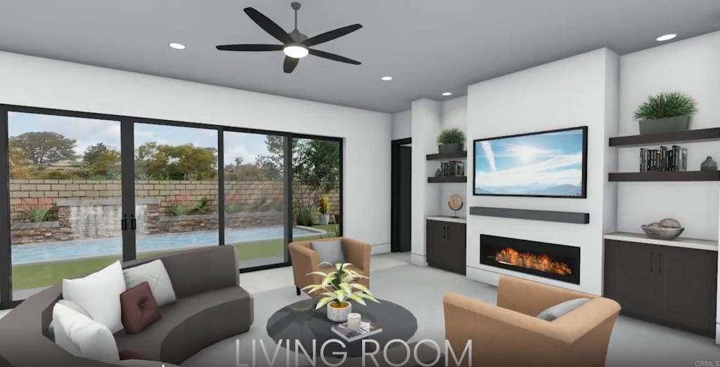 1341 Berryman Encinitas, CA 92024 - Photo 9 of 11 a living room with furniture a flat screen tv and a fireplace