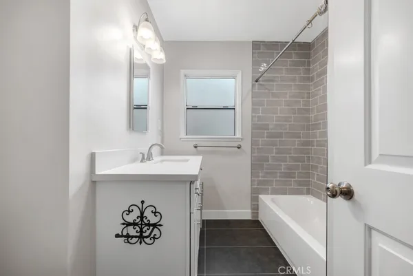 a bathroom with a sink and a bathtub