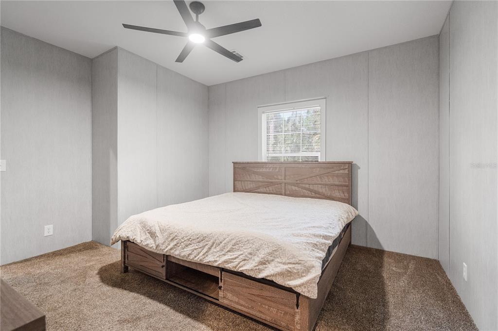 375 Sapp Street Inglis, FL 34449 - Photo 21 of 36 a bedroom with a bed and window