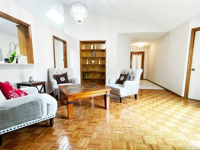 a living room with furniture rug and window
