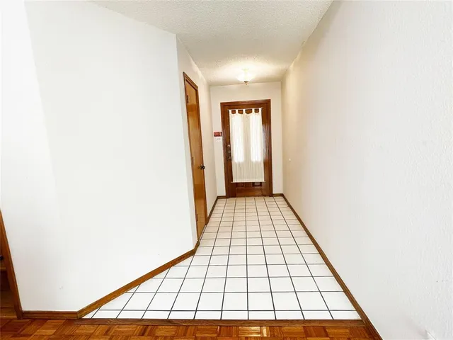 a view of an empty room with windows