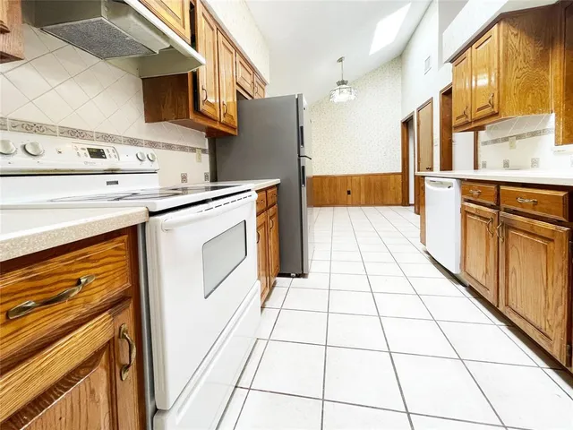 a kitchen with stainless steel appliances cabinets and a counter top