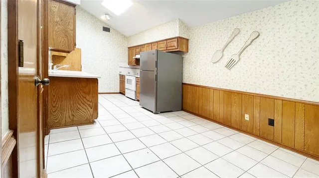 a view of a refrigerator and window