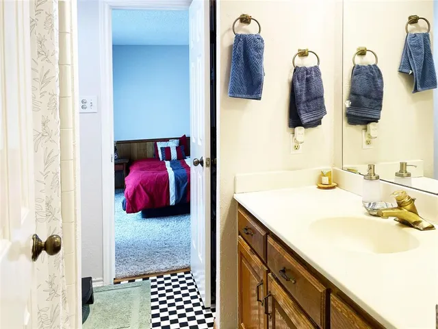 a bathroom with a sink and mirror