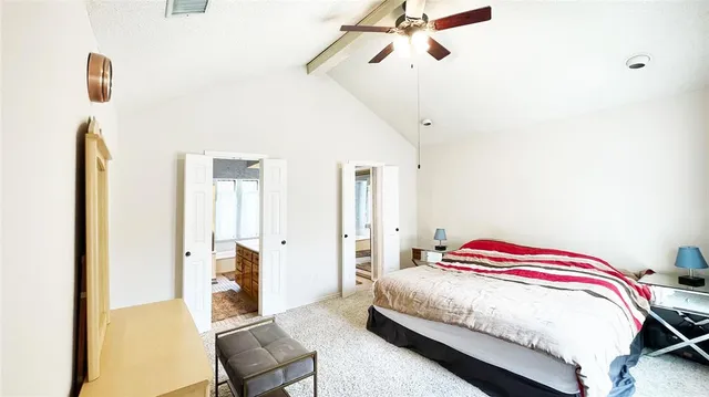 a bedroom with a bed and a chair