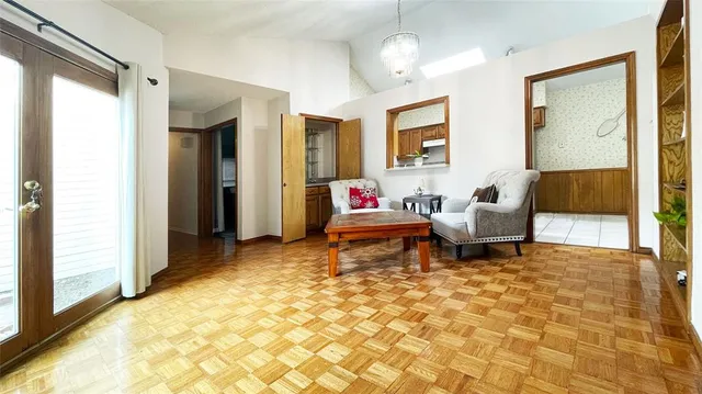 a living room with furniture and a rug