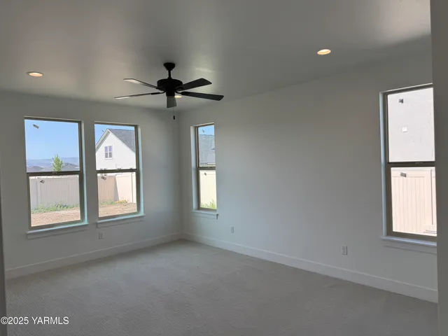 a bathroom with a glass shower door and a sink