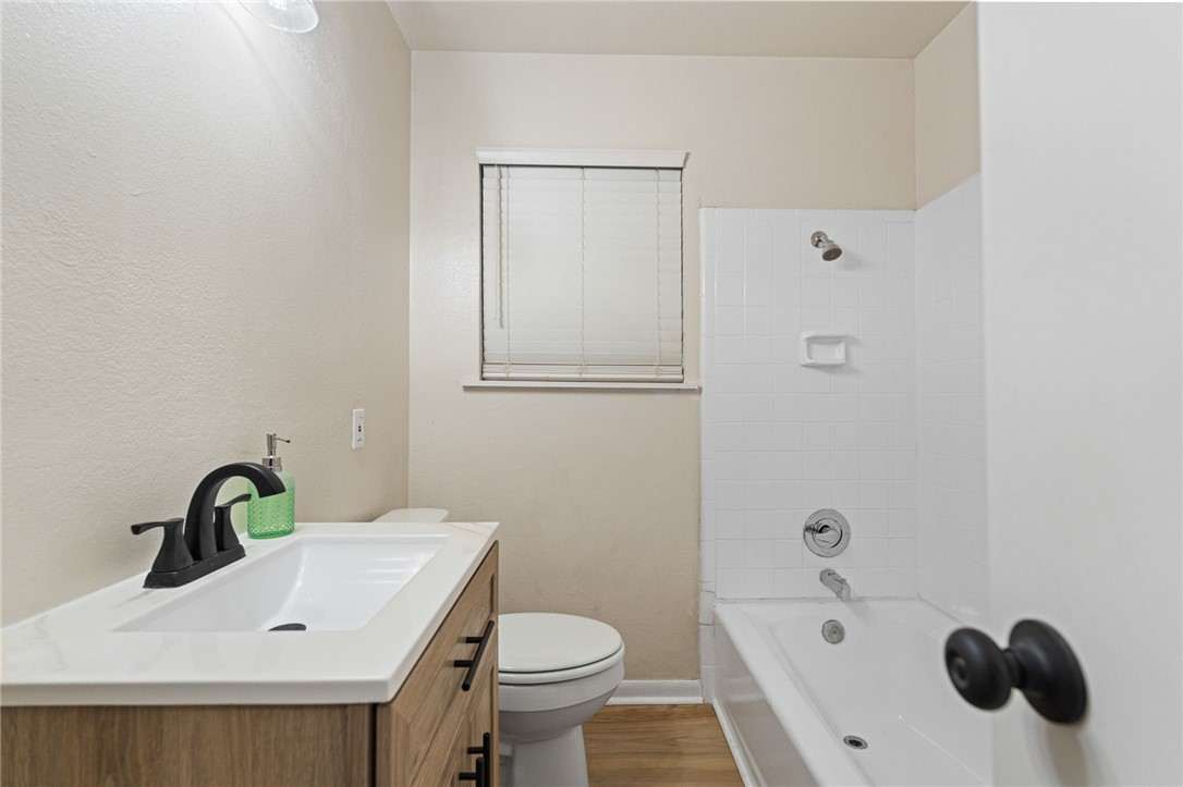5921 Riley Drive Corpus Christi, TX 78412 - Photo 12 of 20 a bathroom with a sink a toilet and shower