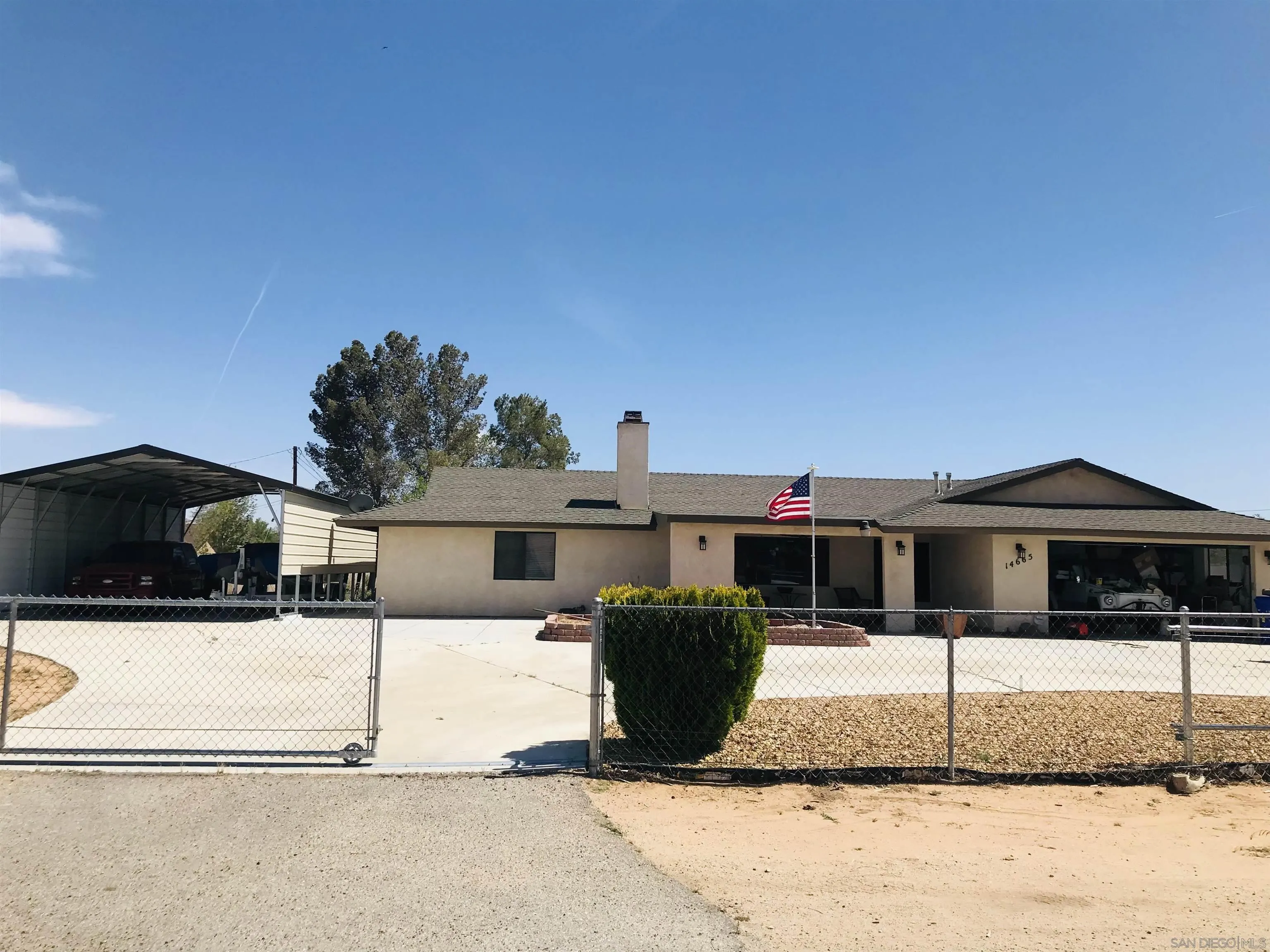 14665 Hopi Road Apple Valley, CA 92307 - Photo 1 of 21 a front view of a house with a yard