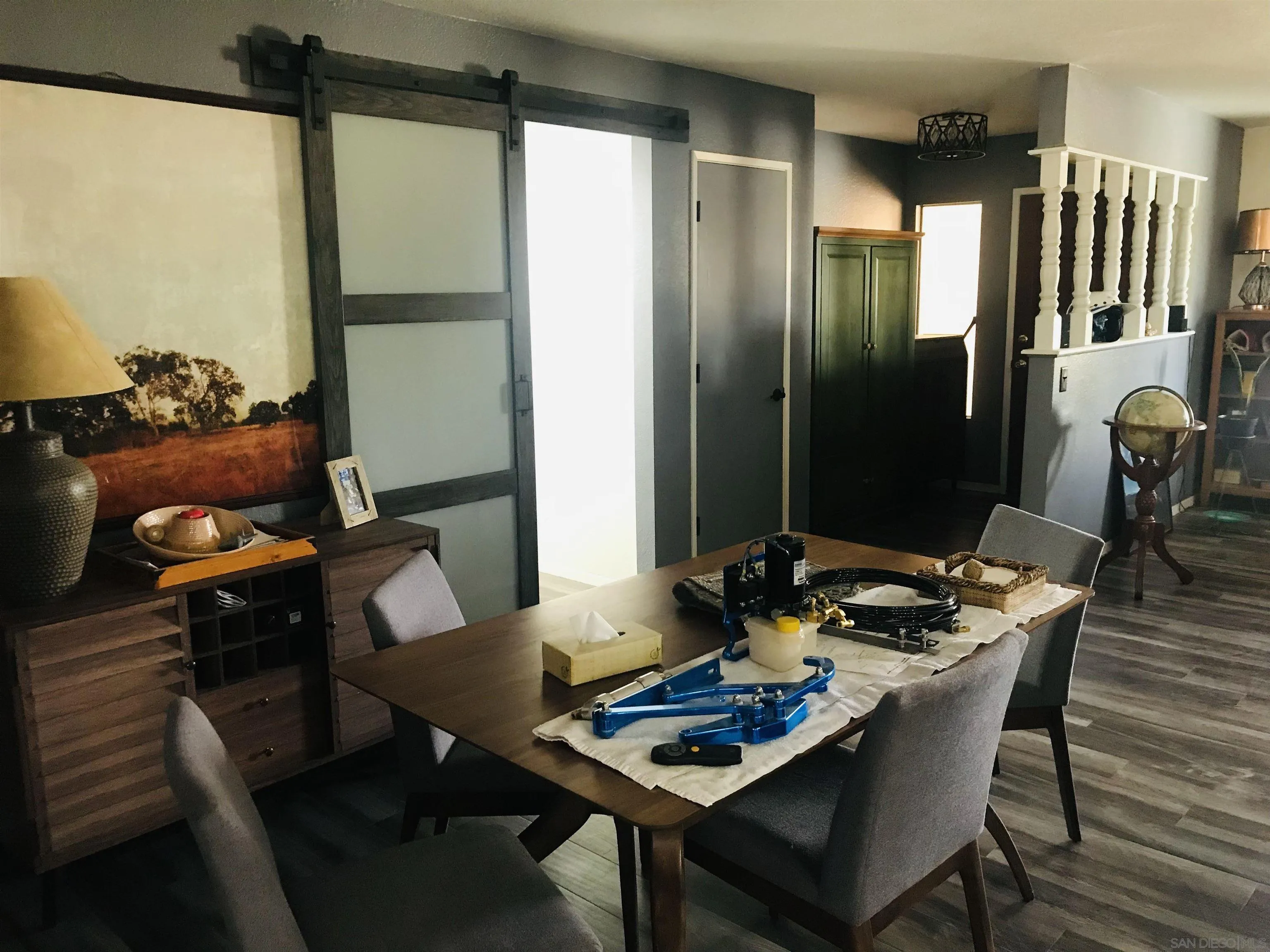 14665 Hopi Road Apple Valley, CA 92307 - Photo 16 of 21 a dining room with furniture and wooden floor