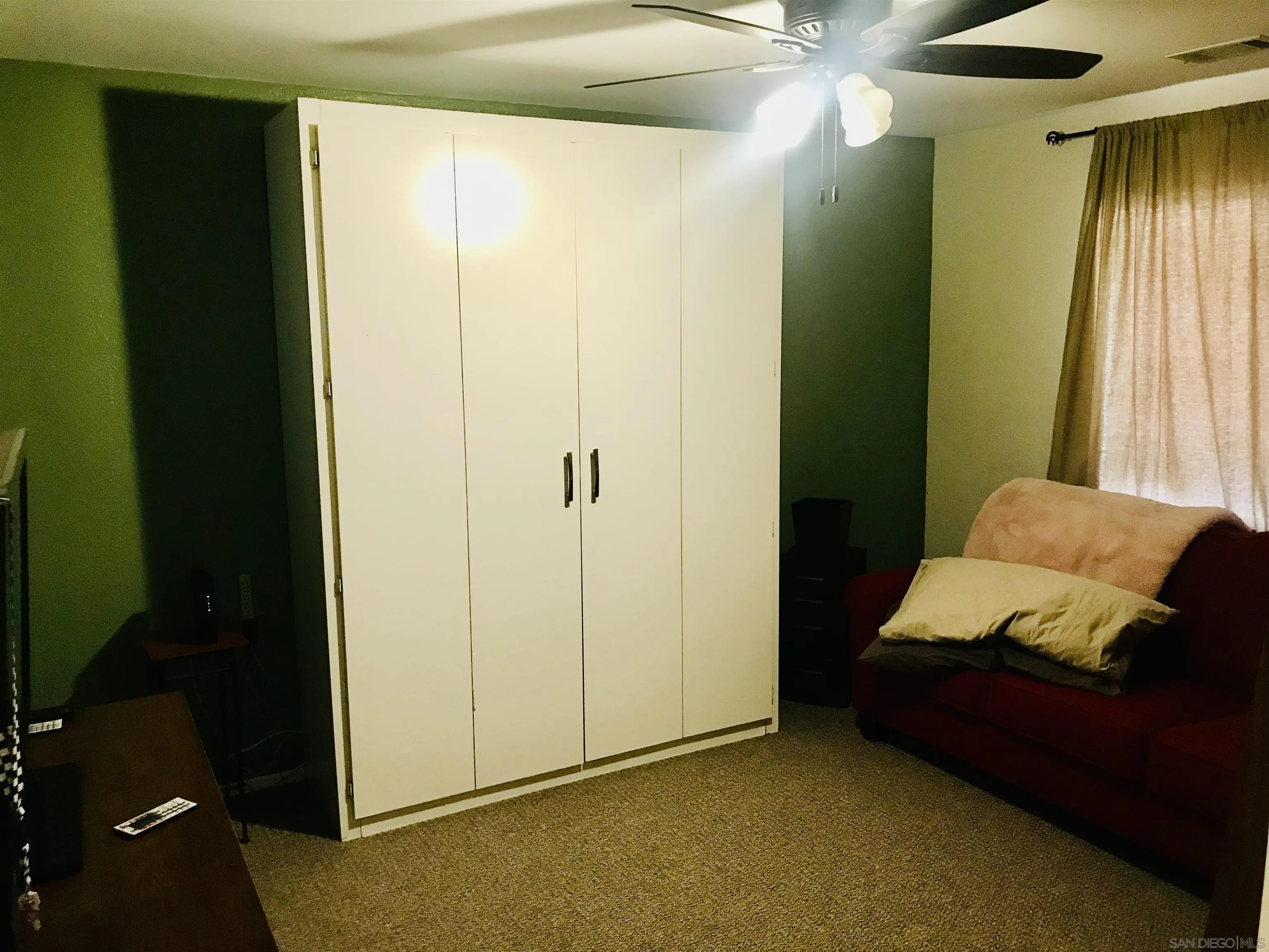 14665 Hopi Road Apple Valley, CA 92307 - Photo 20 of 21 a room that has a bed and a window in it