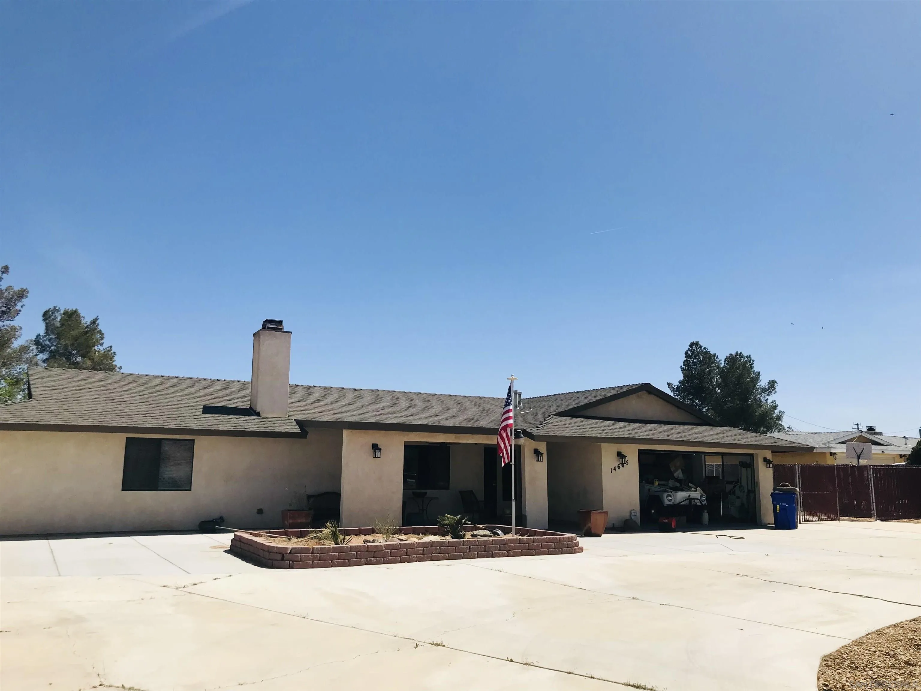 14665 Hopi Road Apple Valley, CA 92307 - Photo 3 of 21 a front view of a house with yard
