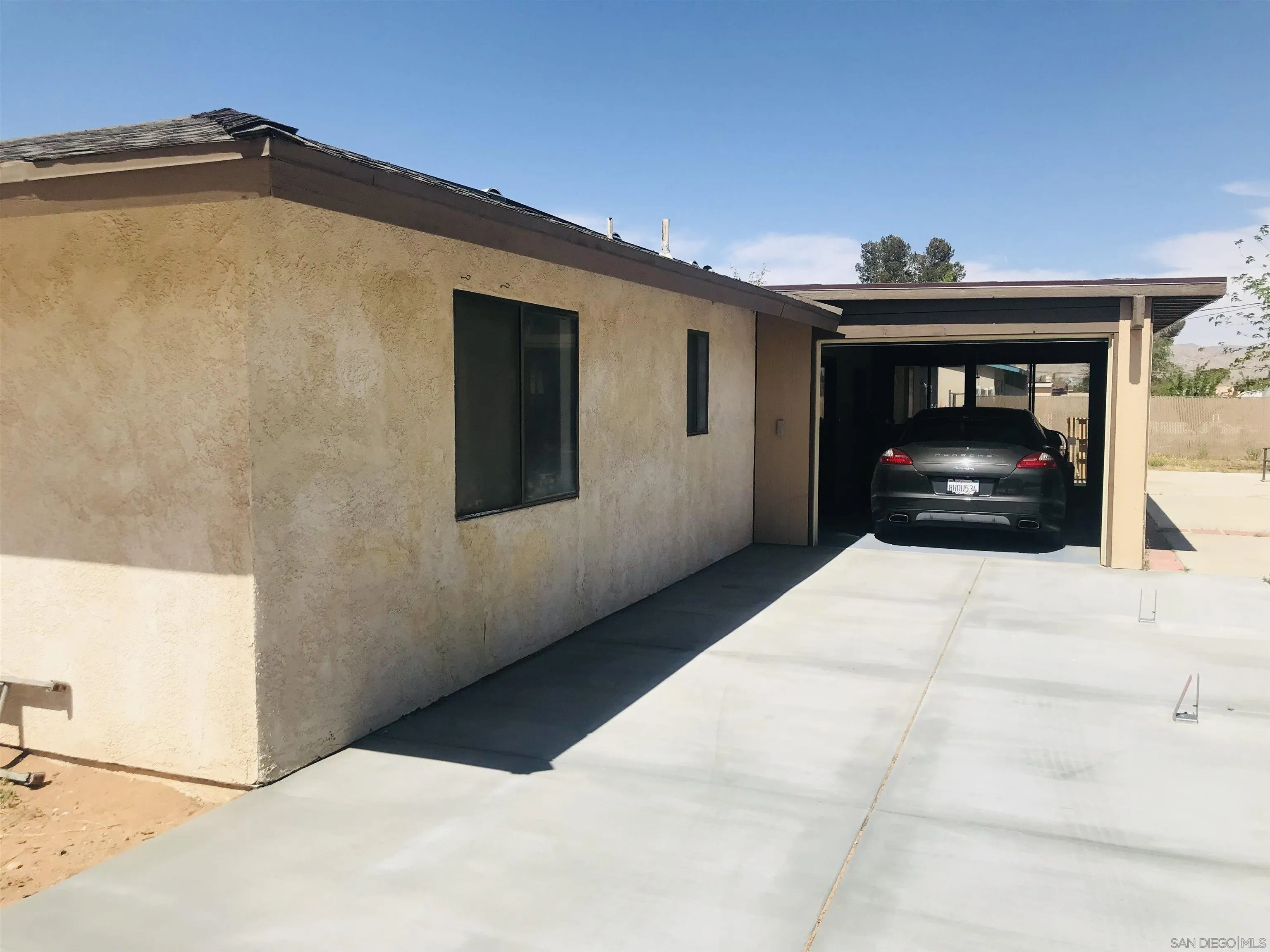 14665 Hopi Road Apple Valley, CA 92307 - Photo 8 of 21 a front view of a house with a yard