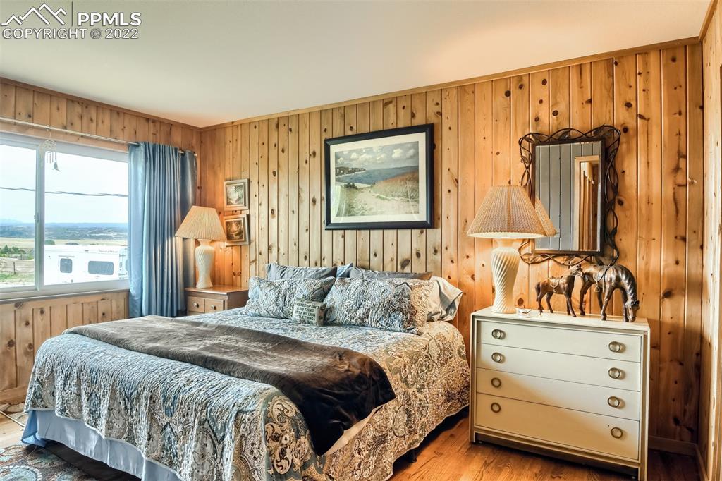1245 South Ridge Road Castle Rock, CO 80104 - Photo 17 of 39 a bedroom with a bed and a window