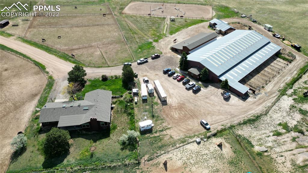 1245 South Ridge Road Castle Rock, CO 80104 - Photo 25 of 39 an aerial view of a house with a backyard