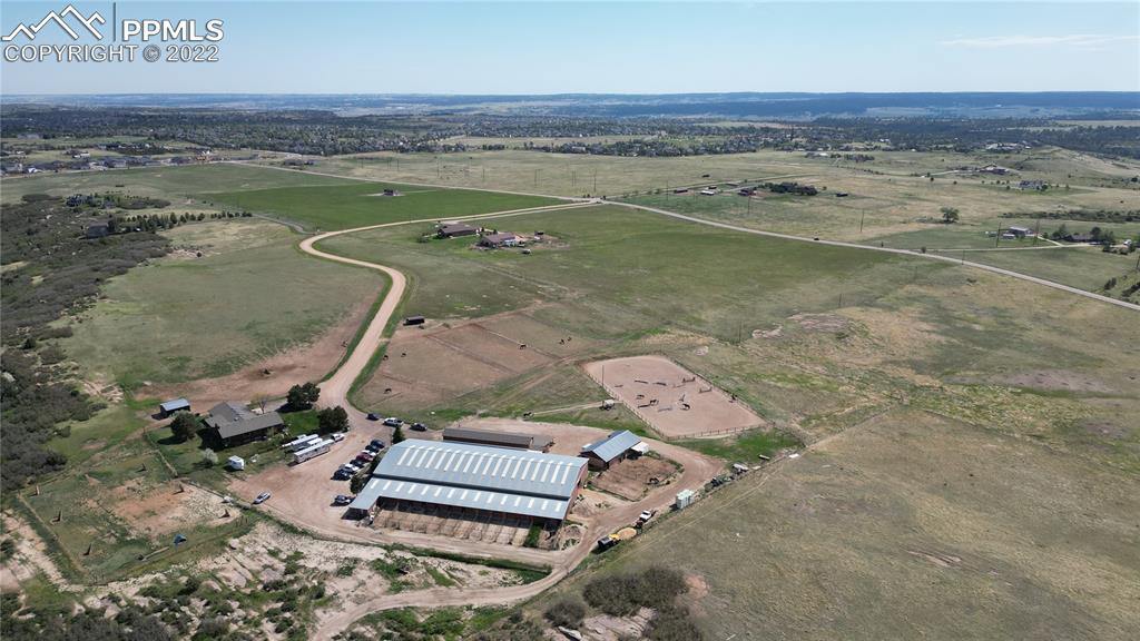 1245 South Ridge Road Castle Rock, CO 80104 - Photo 29 of 39 an aerial view of a house with a yard