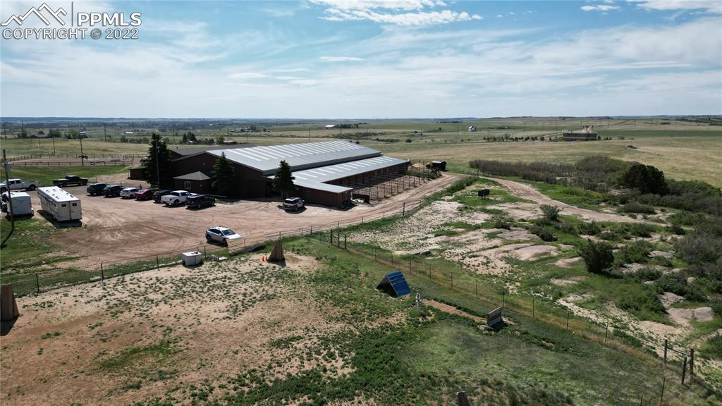 1245 South Ridge Road Castle Rock, CO 80104 - Photo 36 of 39 an aerial view of a house with a yard