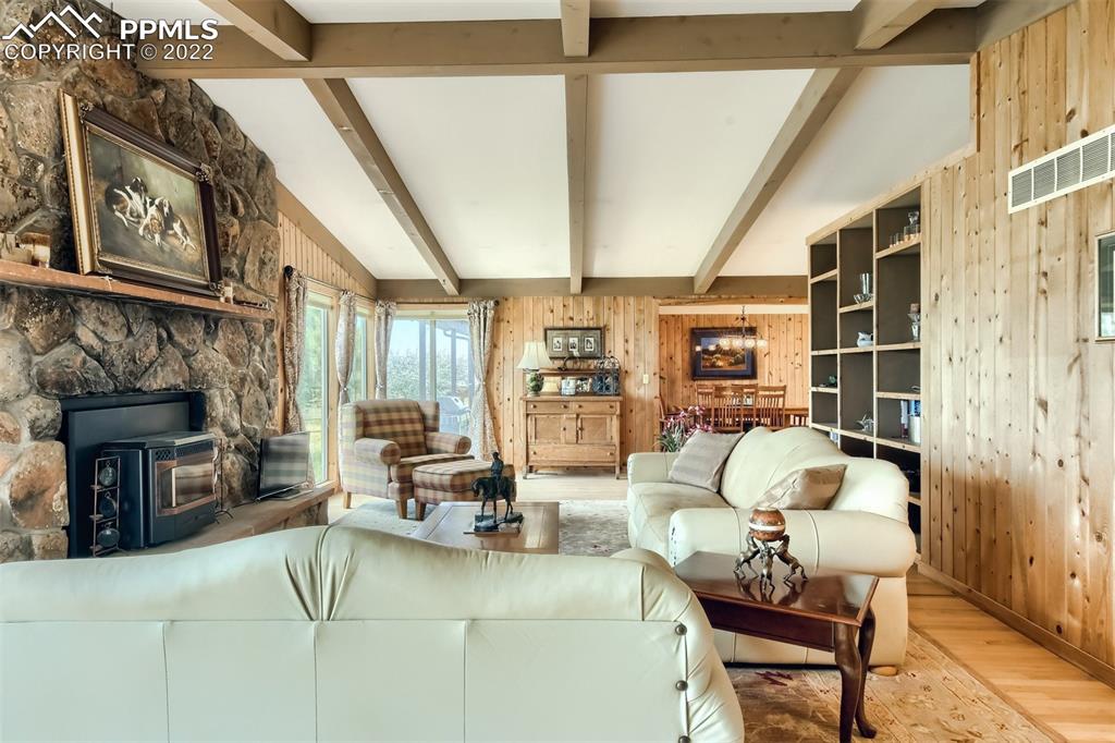 1245 South Ridge Road Castle Rock, CO 80104 - Photo 7 of 39 a living room with furniture fireplace and a fireplace