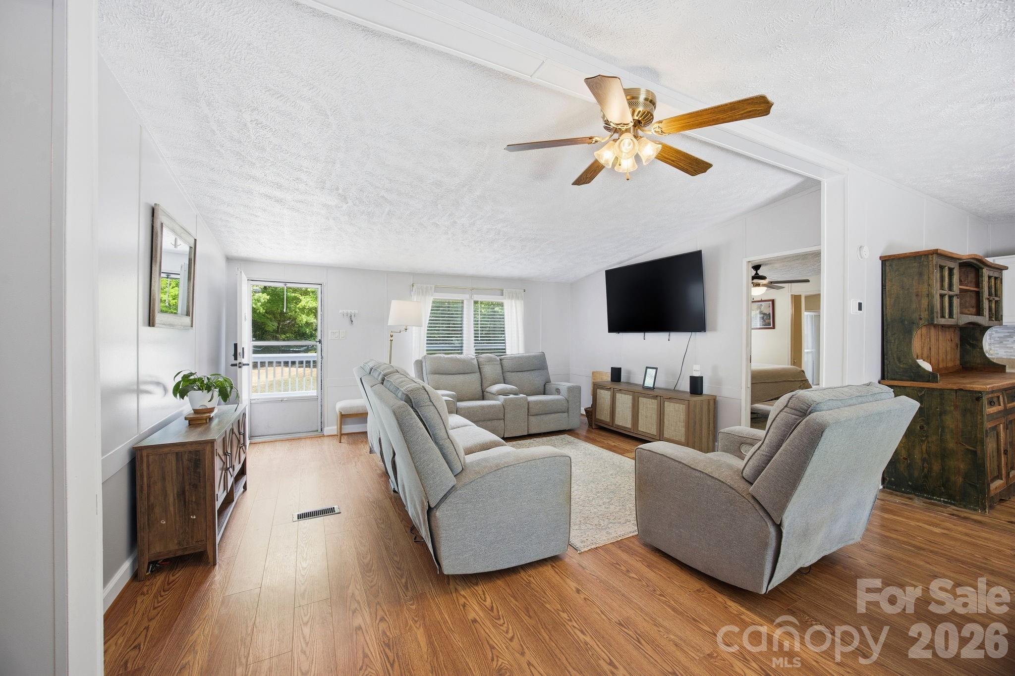 675 Overcash Road Salisbury, NC 28147 - Photo 12 of 48 a living room with furniture and a flat screen tv