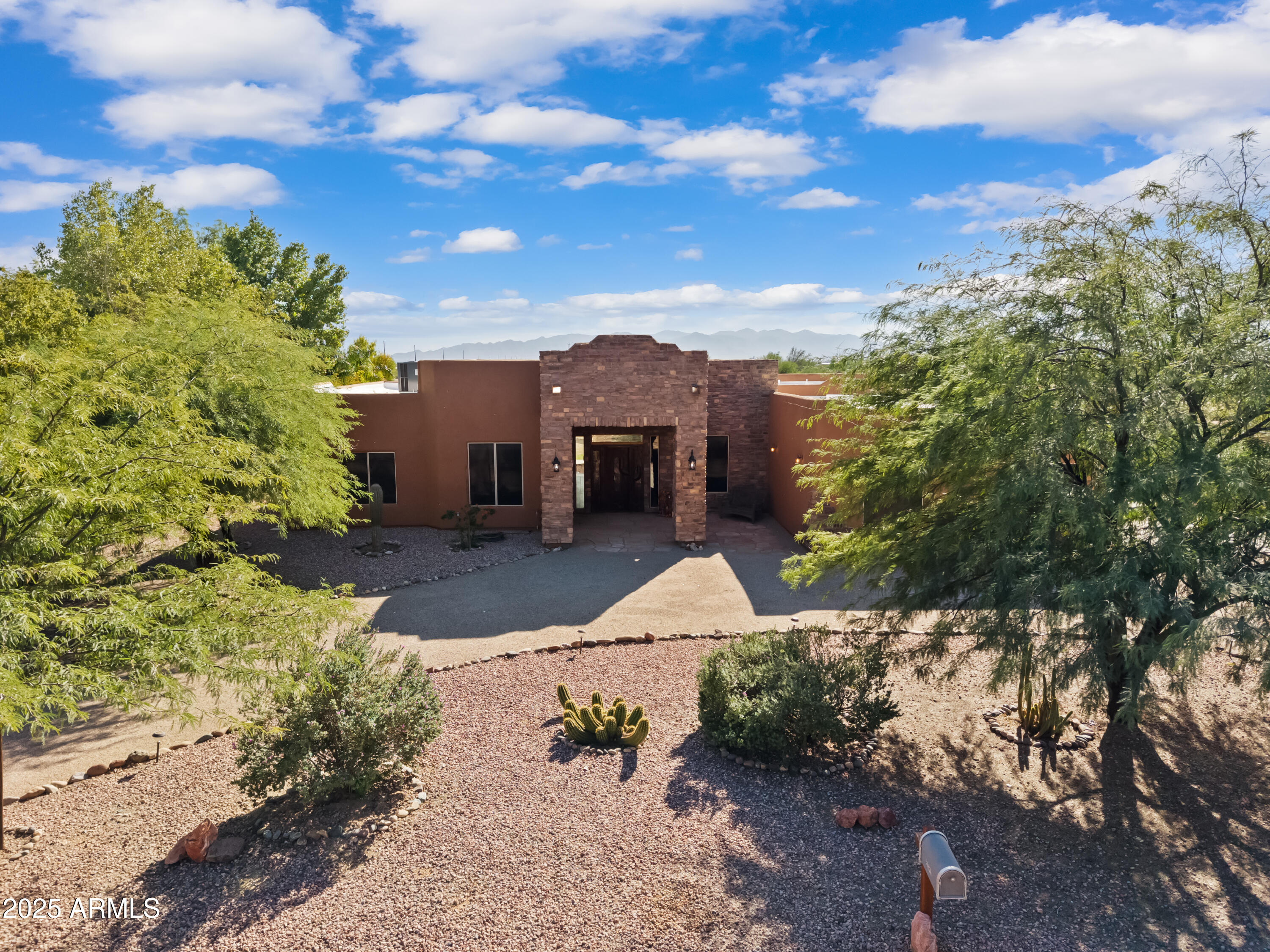 30826 North Crozier Road Wittmann, AZ 85361 - Photo 1 of 65 a view of a garden with an tree