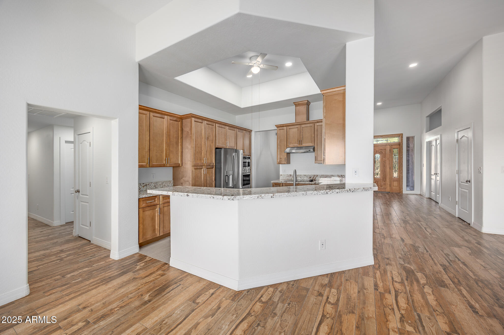 30826 North Crozier Road Wittmann, AZ 85361 - Photo 17 of 65 a living room with stainless steel appliances kitchen island hardwood floor and a large window