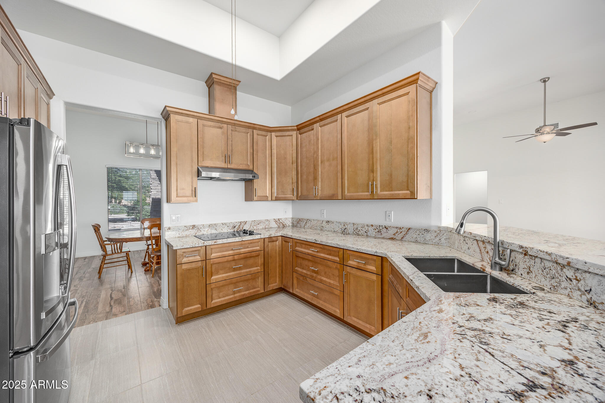 30826 North Crozier Road Wittmann, AZ 85361 - Photo 18 of 65 a kitchen with a sink stove and cabinets
