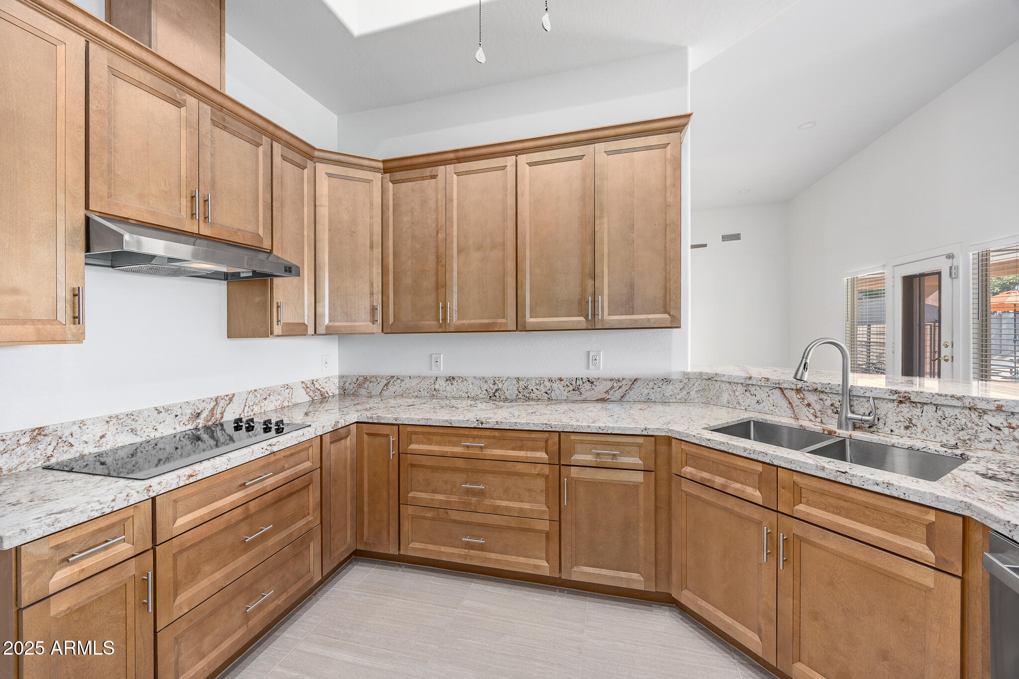 30826 North Crozier Road Wittmann, AZ 85361 - Photo 19 of 65 a kitchen with stainless steel appliances granite countertop a sink stove and cabinets
