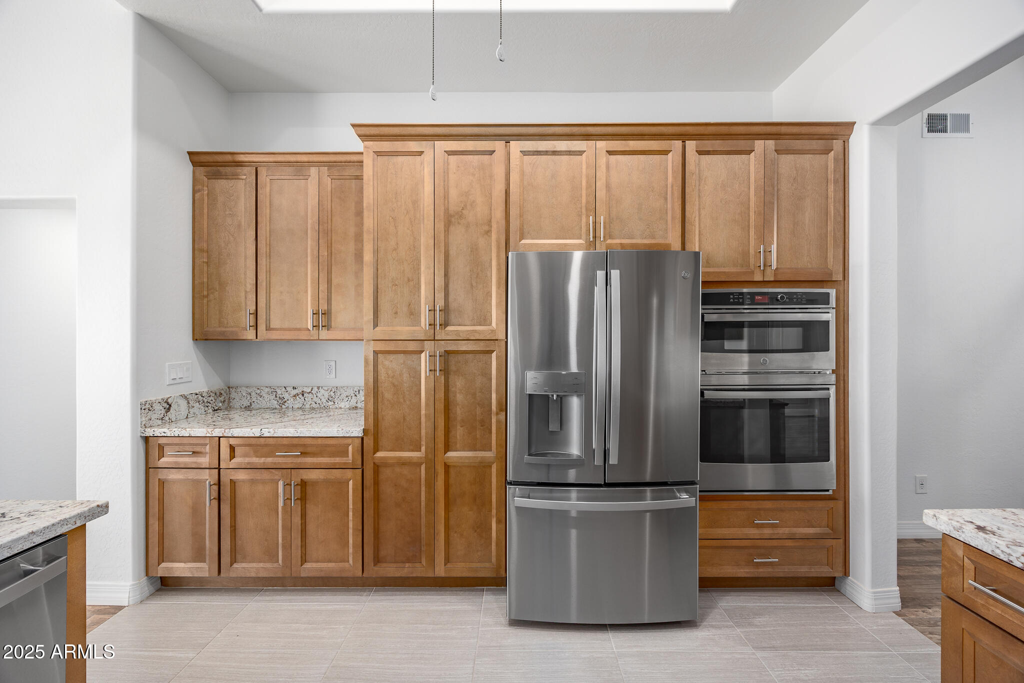 30826 North Crozier Road Wittmann, AZ 85361 - Photo 20 of 65 a kitchen with stainless steel appliances granite countertop a refrigerator and a sink