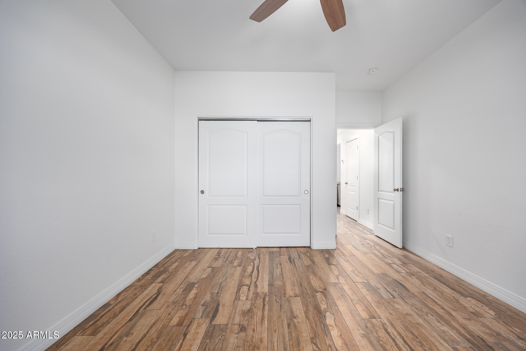 30826 North Crozier Road Wittmann, AZ 85361 - Photo 31 of 65 a view of a room with wooden floor