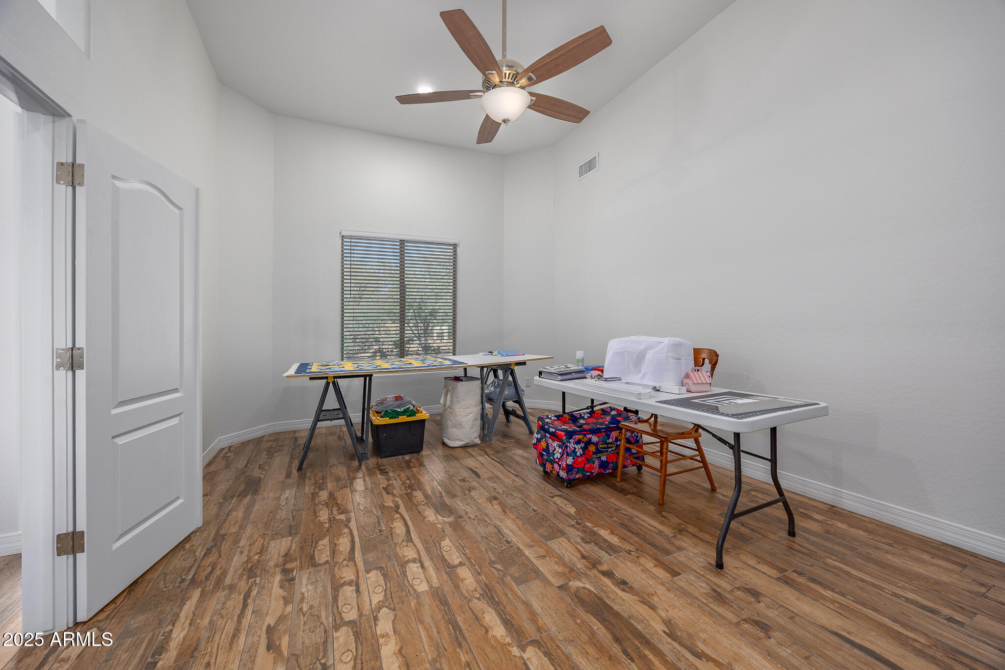 30826 North Crozier Road Wittmann, AZ 85361 - Photo 37 of 65 a living room with furniture and a wooden floor