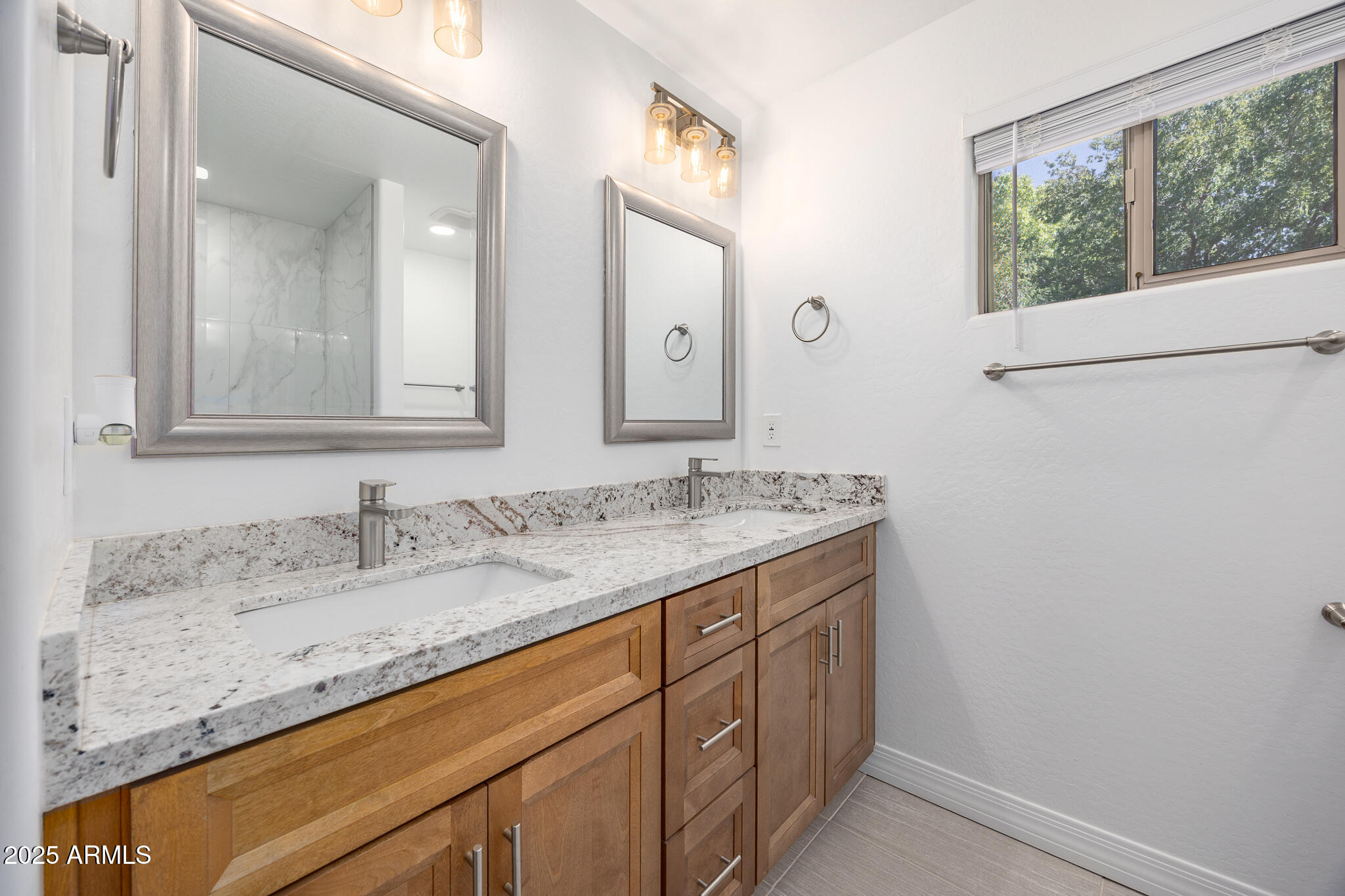 30826 North Crozier Road Wittmann, AZ 85361 - Photo 40 of 65 a bathroom with a granite countertop sink and a mirror