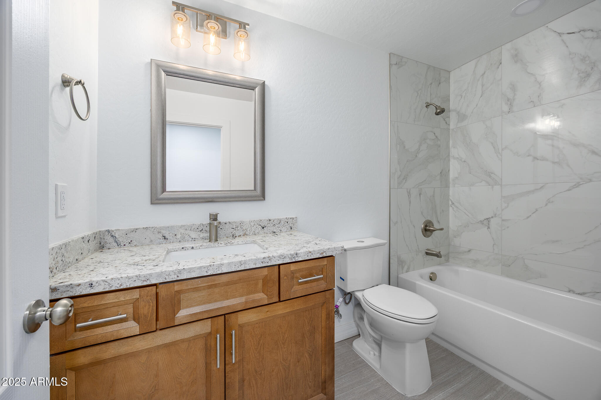 30826 North Crozier Road Wittmann, AZ 85361 - Photo 42 of 65 a bathroom with a granite countertop sink toilet and shower