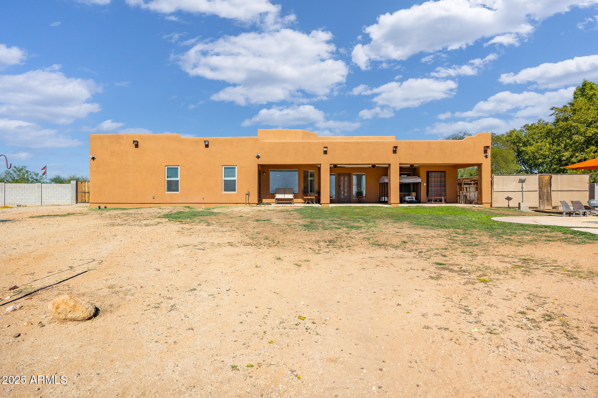 30826 North Crozier Road Wittmann, AZ 85361 - Photo 50 of 65 a view of a large building with a large tree in front of it