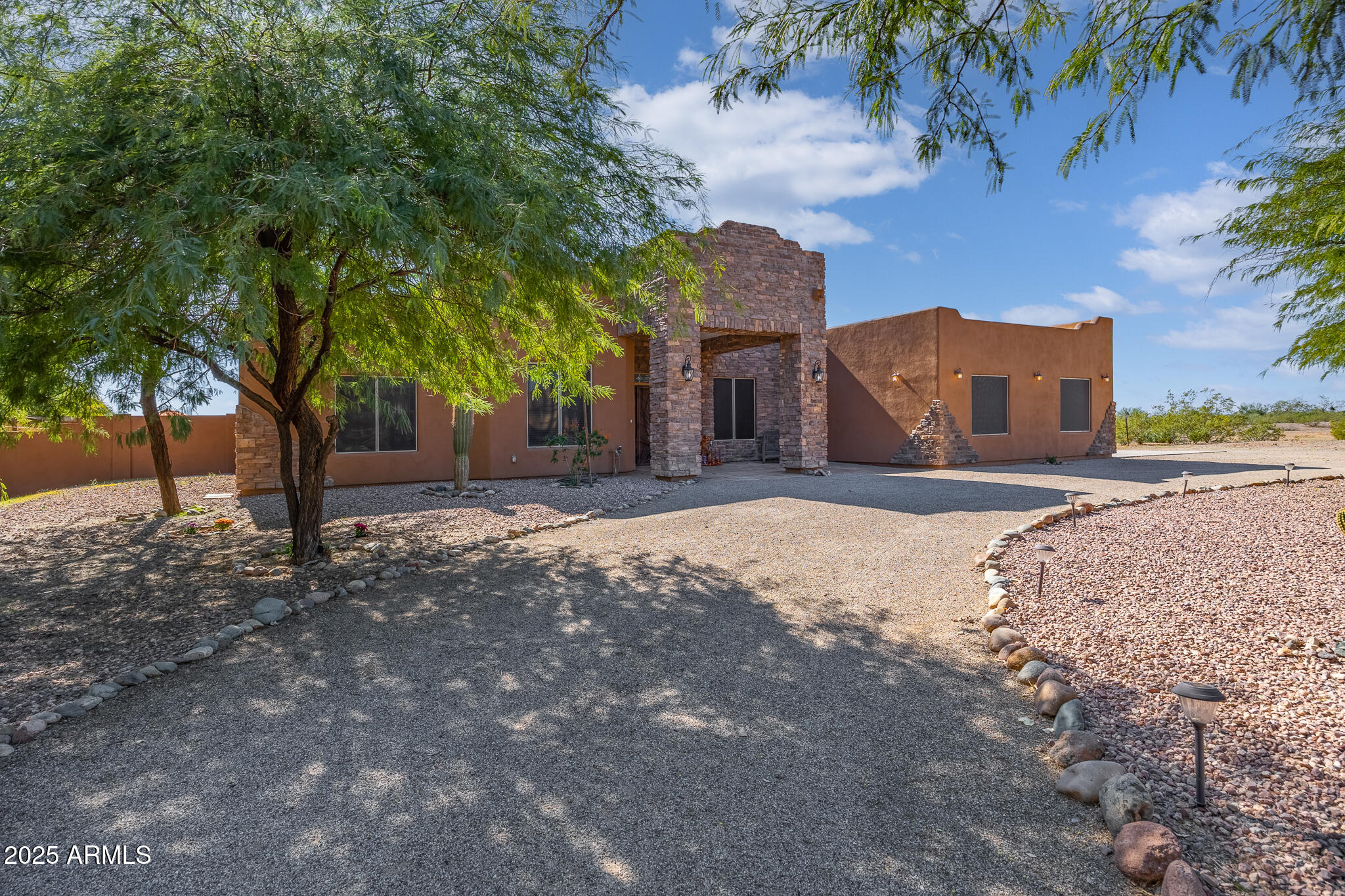 30826 North Crozier Road Wittmann, AZ 85361 - Photo 7 of 65 a view of a house with a yard