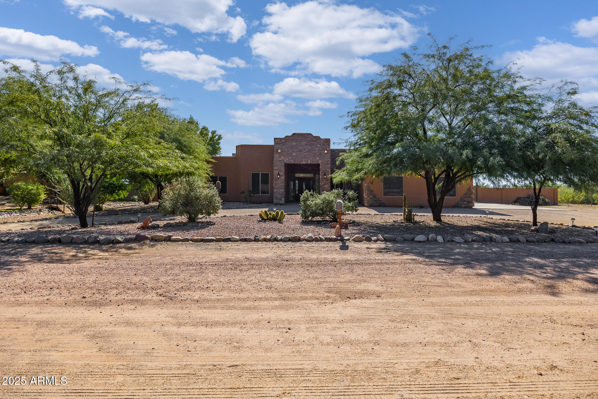 30826 North Crozier Road Wittmann, AZ 85361 - Photo 8 of 65 a backyard of a house with table and chairs