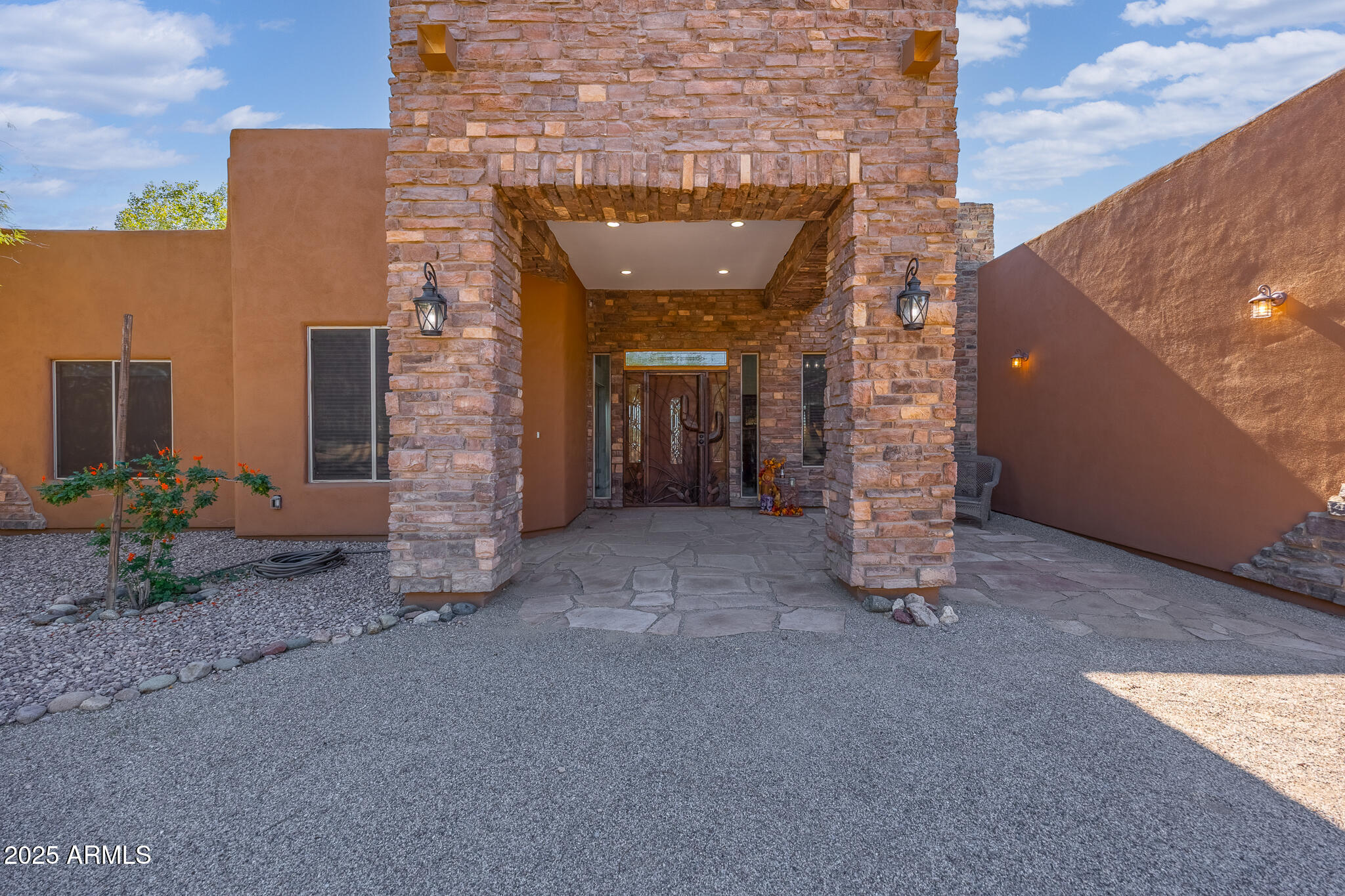 30826 North Crozier Road Wittmann, AZ 85361 - Photo 10 of 65 a view of a brick house with a street