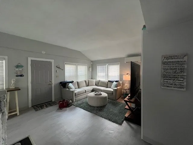 a living room with furniture and a window