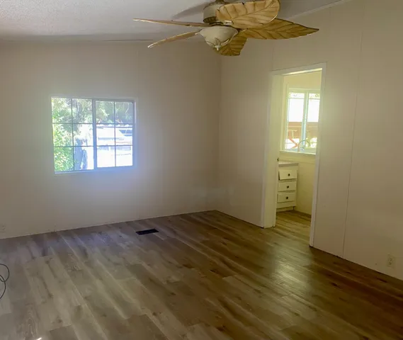 a view of an empty room with a window
