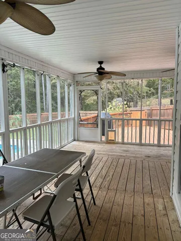 a view of a patio with wooden floor