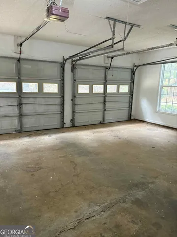 a view of a swimming pool with a yard