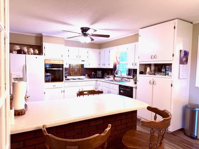 714 Howell Hill Road Flintville, TN 37335 - Photo 7 of 33 a kitchen with stainless steel appliances kitchen island granite countertop a sink a stove a refrigerator cabinets and chairs