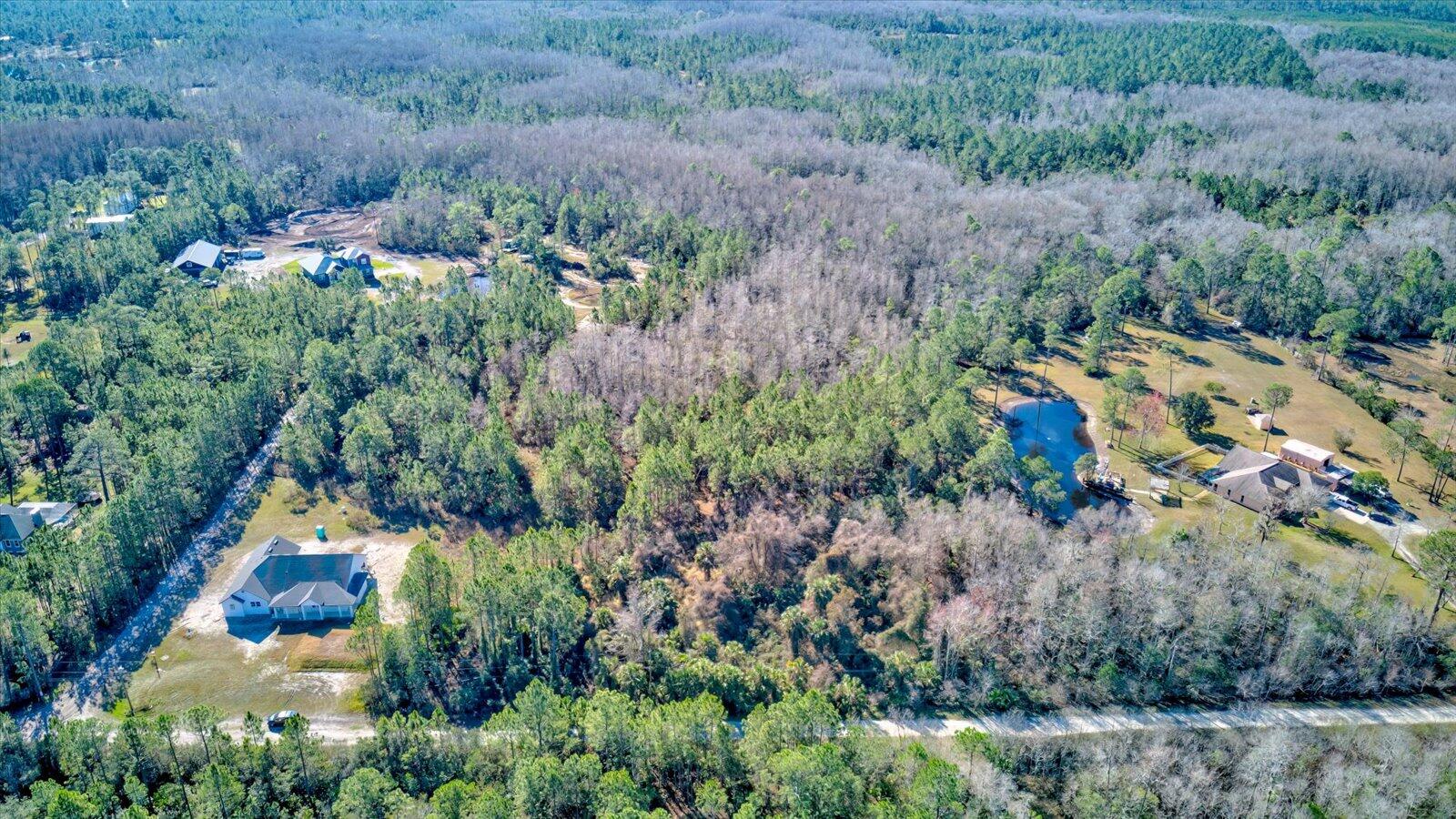 0 Rodeo Acres Drive Ormond Beach, FL 32174 - Photo 1 of 20 an aerial view of residential house with outdoor space and trees all around