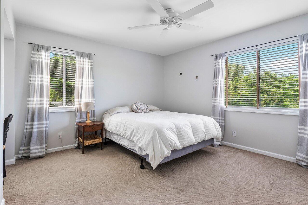 11842 Island Lakes Lane Boca Raton, FL 33498 - Photo 41 of 49 a bed sitting in a room next to a window