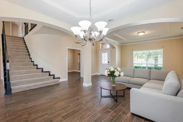a view of staircase with railing and a floor to ceiling window