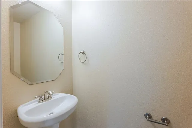 a view of a room with wooden floor and windows